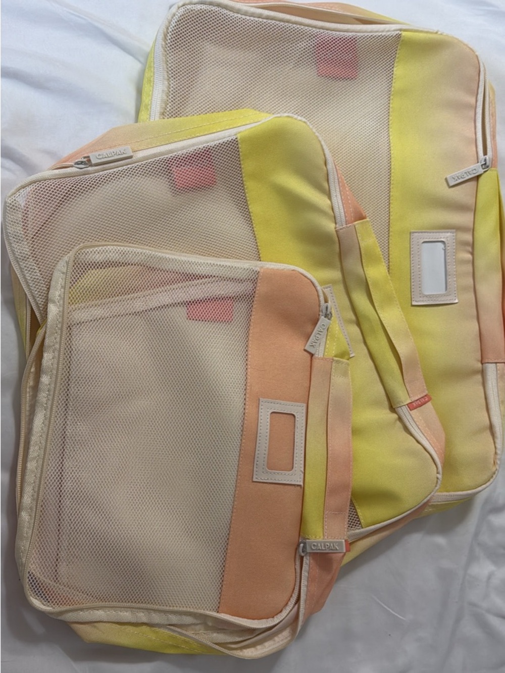 Calpak Pastel Yellow and Peach Travel Packing Cube Set
